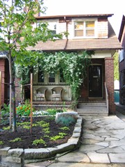 Our house - porch, trellis, stone walk, garden all done by yours truly